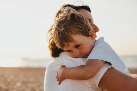 parent hugs child 